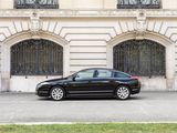 a black car that is parked in front of a building