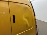 a yellow van with a sticker on the side of it