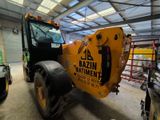 a tractor that is parked inside of a building