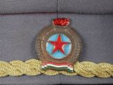 a cap with a star on it on a black surface