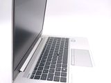 a laptop computer that is sitting on a white table