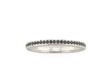 a close up of a ring with black diamonds on a white background