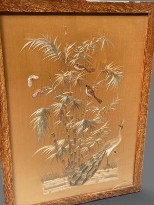 framed picture of a bird and bamboo tree in a wood frame