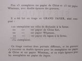 a page of a poem written in french on the wall