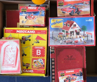 a box full of toys that are sitting on the floor