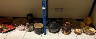 many different types of vases on the floor next to each other