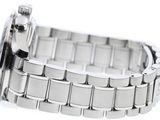 a close up of a wrist watch on a white surface