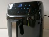 an air fryer sitting on a counter top