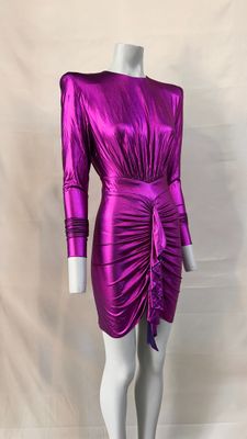 a mannequine wearing a purple dress with long sleeves