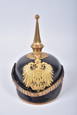 a black and gold helmet with a gold eagle on it