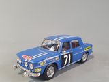 a close up of a blue toy car on a white surface