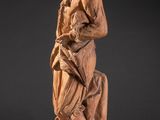 an antique carved wooden statue of a woman holding a child