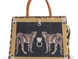 a leopard print handbag with two leopards on it