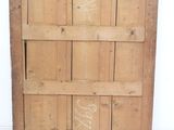 a picture of an old wooden door with graffiti on it