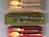 three forks and spoons in a box with a knife and fork