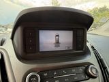 a picture of a car dashboard with a cell phone in it