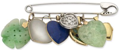 a broochee with a variety of stones on it