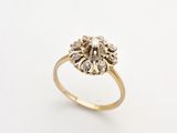 a close up of a gold ring on a white background