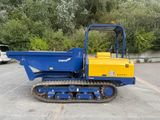a small blue and yellow construction vehicle parked in a parking lot