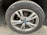 a close up of a tire on a car ' s rim