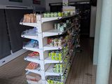 a store with a lot of food and drinks on the shelves