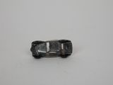 a toy car that is sitting on a white surface