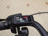 a close up view of a bike ' s handlebar with a display on it