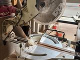 someone is using a circular saw to cut a piece of wood