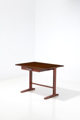 an image of a small wooden table on a white surface
