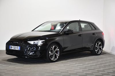 a black car parked in a room with a checkered floor