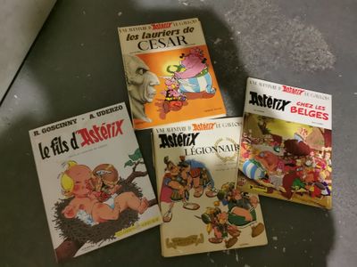 several children ' s books are lined up on a table