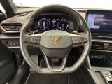 the interior of a car with a steering wheel and dashboard controls