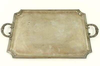 an antique silver tray with handles and handles on a white surface