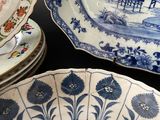 a lot of plates that are sitting on a table