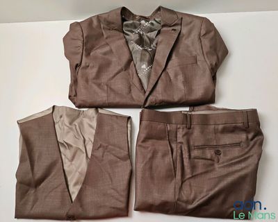 three pieces of clothing sitting on a white surface