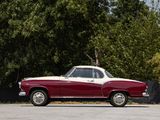a red and white car parked in a parking lot