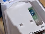 a cooler that has a bottle of water inside of it