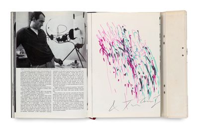 an open book with a picture of a man working on a painting