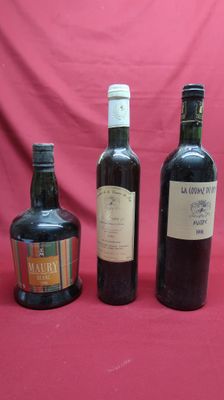 three bottles of wine sitting next to each other on a table