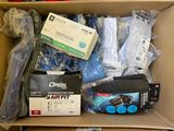 a cardboard box filled with electronics and other items