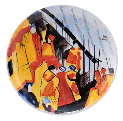 a plate with a painting of a group of people on it