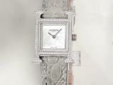 an image of a woman ' s wrist watch with diamonds on it