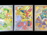 pokemon trading cards are displayed on a black background