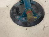 a picture of a floor polisher on the floor next to a yellow box