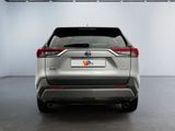 the rear end of a silver toyota rav parked in a garage