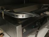 a stove top with a pan on top of it