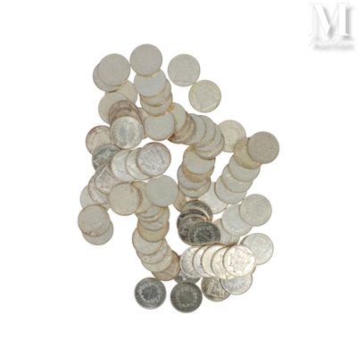 a pile of silver coins on a white background