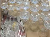 a box of empty wine glasses sitting on a table