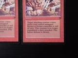 two cards that are sitting on a table