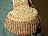 a close up of a military uniform with a badge on it